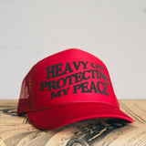 HEAVY ON PROTECTING MY PEACE Trucker Cap (More Colors)